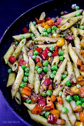 This entirely satisfying, vegan cashew pesto penne pasta is light, amazing to look at and easy on your stomach. Creamy cashew pesto with fresh peppery sauce coats perfectly cooked al dente penne. This simple dish is easy to make and is a feast of colors. | www.delishbuzz.com