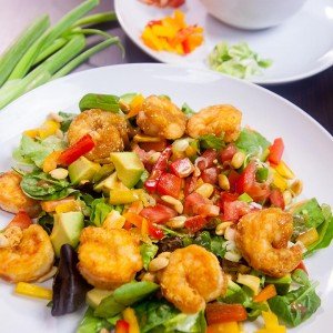 Shrimp avocado salad, a wonderfully satisfying main course salad. Crunchy, sweet, sour and nutty. This colorful salad explodes with flavors and textures. At the same time, it brings together luscious greens, sweet peppers, scallions, peanuts and creamy avocados with a perfectly crafted dressing. www.delishbuzz.com