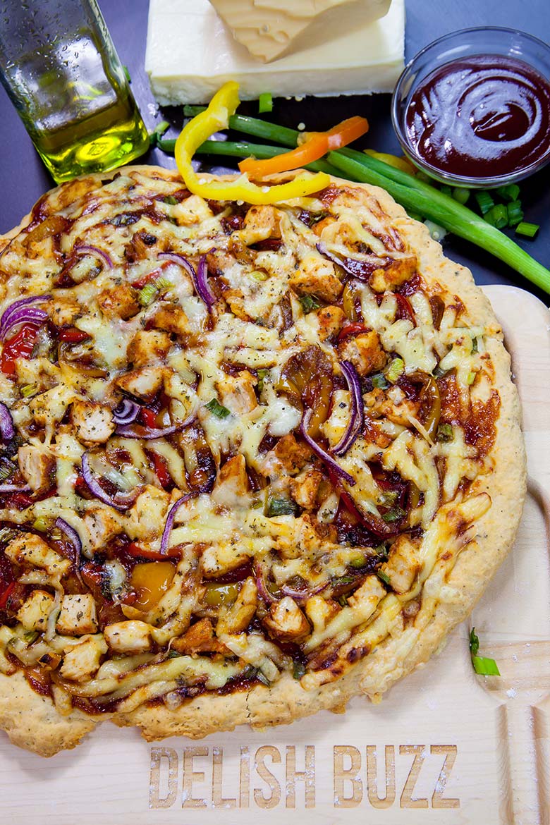 The best part is that you get to eat the slice quick! Easy Barbeque Chicken Pizza explodes with flavors in your mouth. Instant no rise homemade crust along with barbeque sauce, sweet peppers and gouda cheese makes this pizza irresistible. www.delishbuzz.com