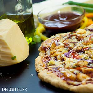 Everything is easy here. No wait dough! Just mix, knead, spread and bake! Easy Barbecue Chicken Pizza explodes with flavors in your mouth. Instant no rise homemade crust along with barbecue sauce, sweet peppers and gouda cheese makes this pizza irresistible. www.delishbuzz.com