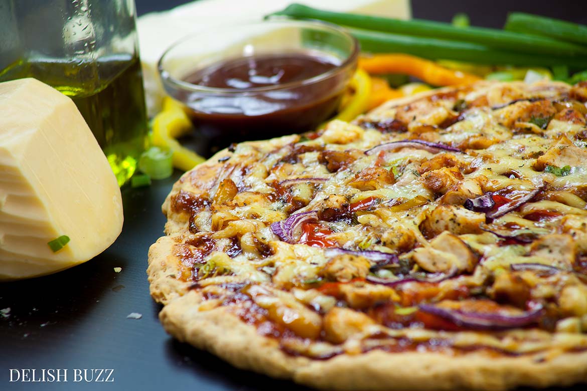 Everything is easy here. No wait dough! Just mix, knead, spread and bake! Easy Barbeque Chicken Pizza explodes with flavors in your mouth. Instant no rise homemade crust along with barbeque sauce, sweet peppers and gouda cheese makes this pizza irresistible. www.delishbuzz.com