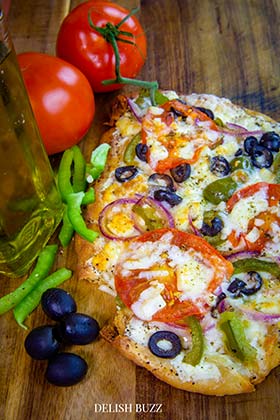 Fancy fresh flavors! Love the Greek style fresh style of veggies and cheese!. A robust Greek pizza, full of fresh crispy flavors. Satisfying naan bread pizza with perfectly melted cheeses. Perfect meal for a busy day. Prepped and ready to eat in minutes. - www.delishbuzz.com