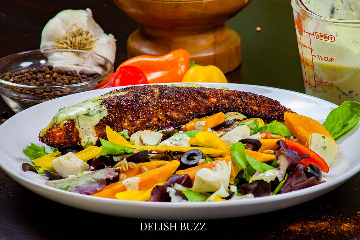 This simple salad is one of the meals I ever had! A very satisfying aroma rich creamy blackened salmon salad with a creamy homemade gingery dressing! Crunchy, creamy, salty, sweet salad with juicy salmon. www.delishbuzz.com