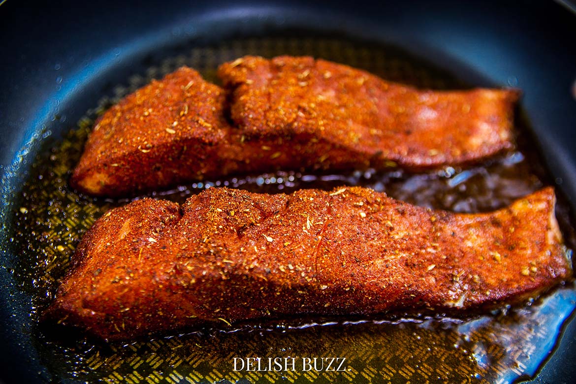 Incredible aroma of blackened seasoning will fill the house. A very satisfying aroma rich creamy blackened salmon salad with a creamy homemade gingery dressing! Crunchy, creamy, salty, sweet salad with juicy salmon. www.delishbuzz.com